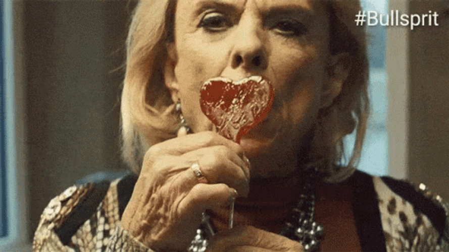 Old Cougar Licking Candy GIF