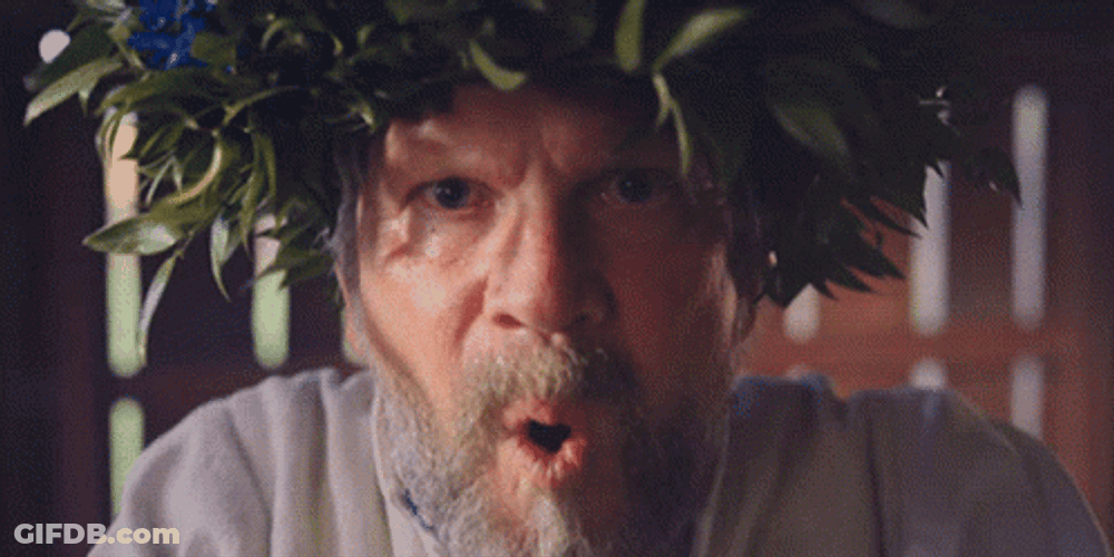 Old Man Blow Sand To Camera GIF