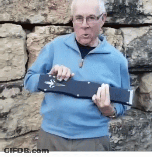 Old Man Holding Big Butterfly Knife GIF
