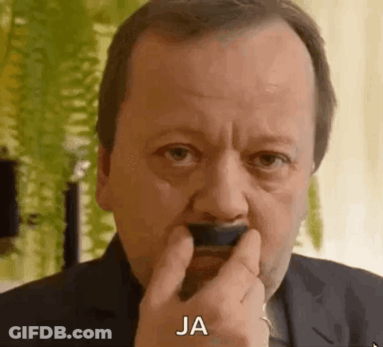 Old Man Playfully Rubbing Mustache GIF