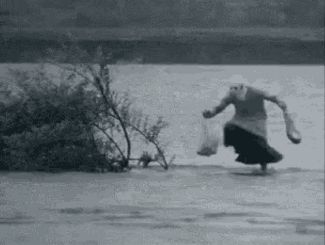 Old Man Playing In Rain GIF