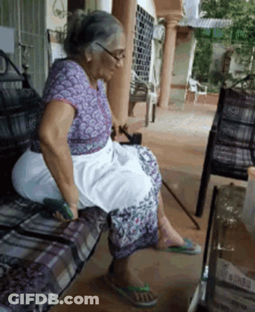 Old Woman Having Hard Time Standing Up GIF
