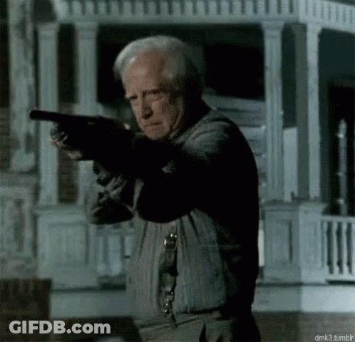 Older Man Holding Gun GIF