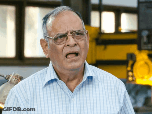 Older Man In Blue Shirt And Glasses Funny Face GIF