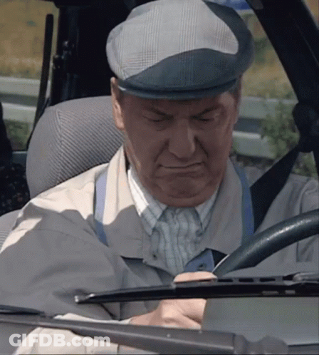 Older Man In Hat Sitting In Car GIF