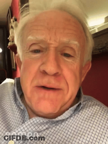 Older Man In Plaid Shirt Making Funny Face With Open Mouth GIF