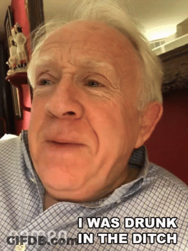 Older Man In Plaid Shirt Making Funny Face GIF