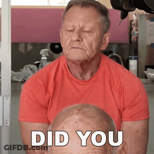 Older Man In Red Shirt Looking At Face Saying Did You GIF