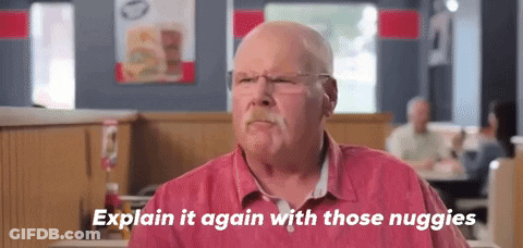 Older Man In Red Shirt Sitting At Diner Table GIF