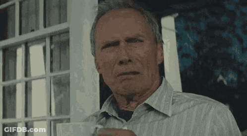 Older Man In Striped Shirt Holding Coffee GIF