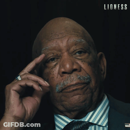 Older Man In Suit And Tie Saying Lioness GIF