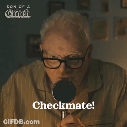 Older Man Looking Through Magnifying Glass GIF
