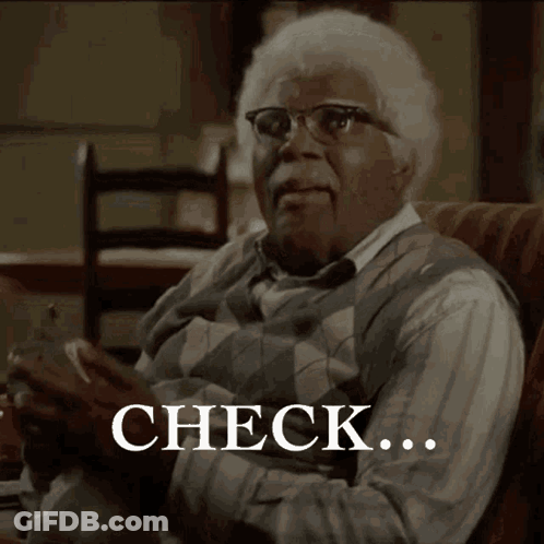 Older Man On Couch With Check GIF