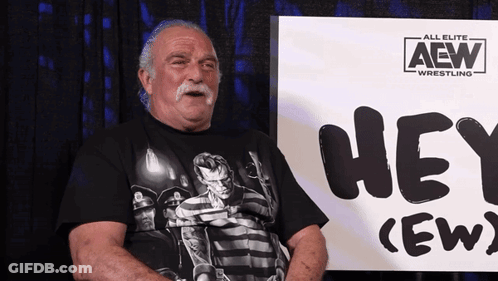 Older Man Sitting In Front Of Hey Crew Sign GIF