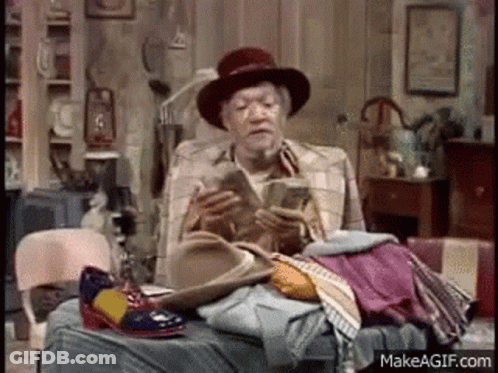 Older Man Sitting On Bed Reading GIF