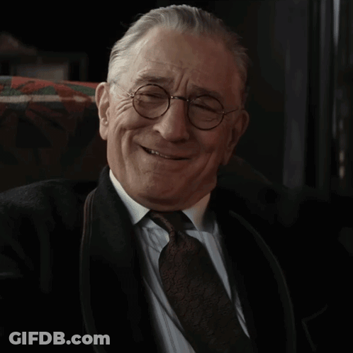 Older Man Smiling In Glasses And Tie GIF
