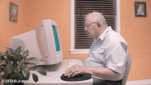 Older Man Using Computer And Mouse GIF