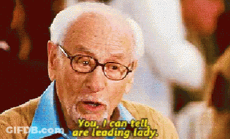 Older Man With Glasses And Beard Says Leading Lady GIF
