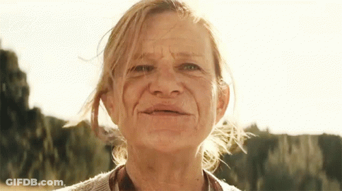 Older Woman Close Up With Trees GIF