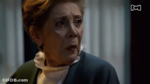 Older Woman Crying In Front Of TV With BC GIF