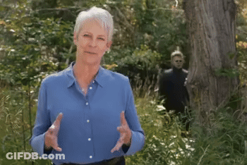 Older Woman In Blue Shirt In Forest GIF