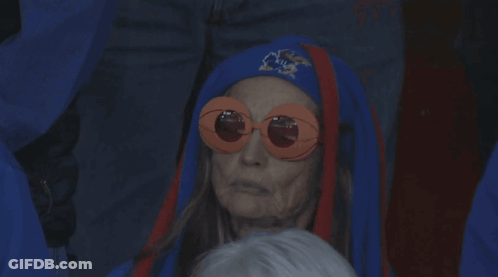 Older Woman In Sunglasses And Blue Hat With Letter A GIF
