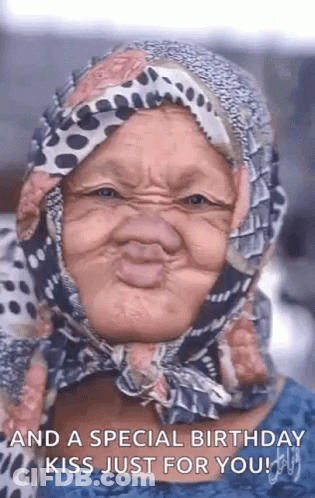 Older Woman Making Funny Face And Birthday Kiss GIF