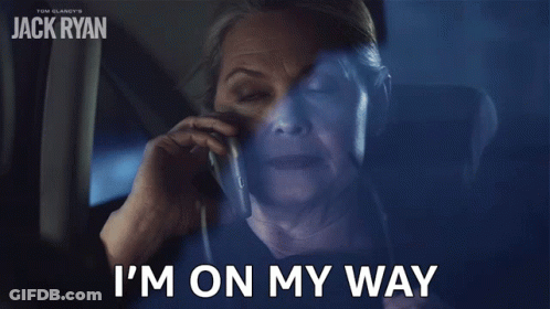 Older Woman On Cell Phone Saying I'm On My Way GIF