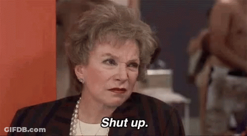 Older Woman Saying Shut Up Sitting In Room GIF