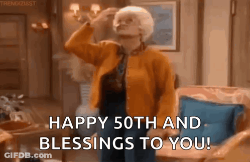Older Woman Standing In Living Room With Hand On Forehead GIF