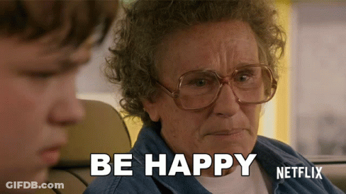 Older Woman With Glasses Says Be Happy Next To Young Boy GIF