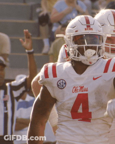 Ole Miss Football Player In White Jersey With Red Stripes GIF