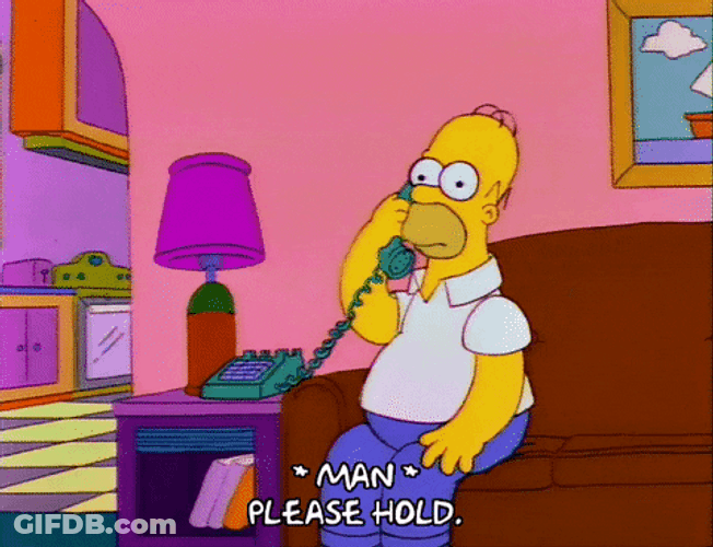 On Hold Homer Simpson Sitting On Couch GIF