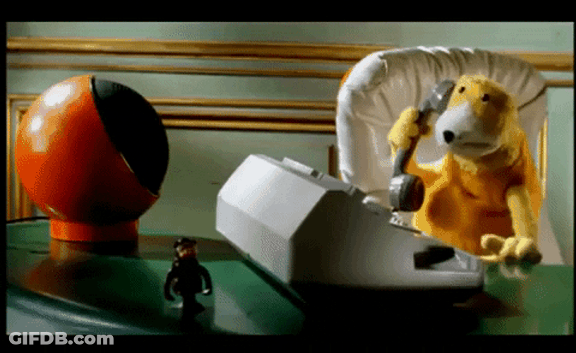 On Hold Yellow Puppet In Table GIF