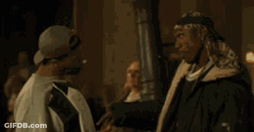 One Man Saying Popcorn To Another GIF