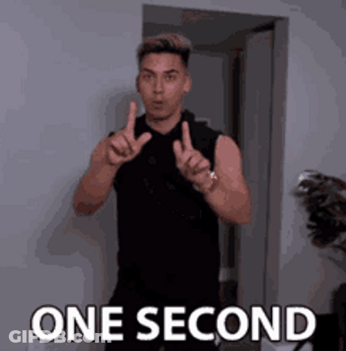 One Sec Man In Black GIF