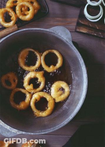 Onion Rings Cooking In Skillet GIF
