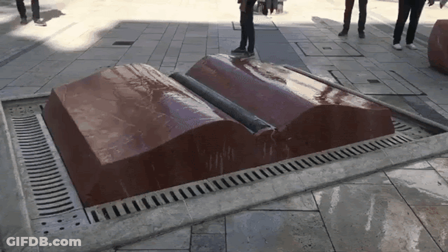 Open Book Sculpture Water Pages GIF