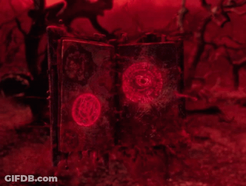 Open Book With Red Glowing Circle GIF
