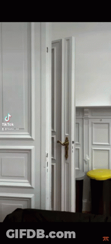Open Door To Room With Trash Can GIF