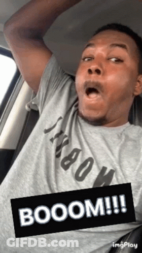 Open-Mouthed Man In Grey Shirt In Car GIF