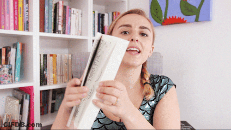 Opening Comic Book With Hannah Witton GIF