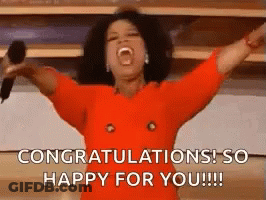 Oprah Winfrey Is Holding A Microphone With Her Arms In The Air And Shouting Congratulations ! So Happy For You !!! GIF