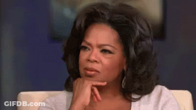 Oprah Winfrey Is Sitting In A Chair With Her Hand On Her Chin And A Serious Look On Her Face . GIF
