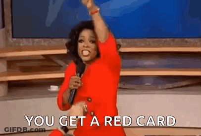 Oprah Winfrey Is Wearing A Red Dress And Holding A Microphone While Saying `` You Get A Red Card '' . GIF