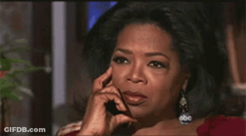Oprah Winfrey Talking On A Cell Phone With Her Hand On Her Chin GIF