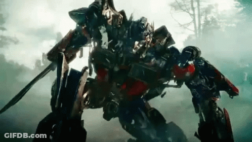 Optimus Prime Holding Sword And Shield In Forest GIF