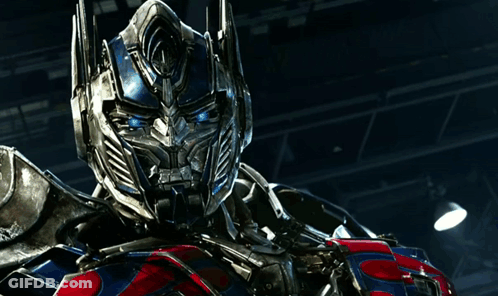 Optimus Prime Standing In Dark Room GIF