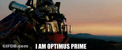 Optimus Prime Standing In Front Of Sunset With Telescope On Head GIF