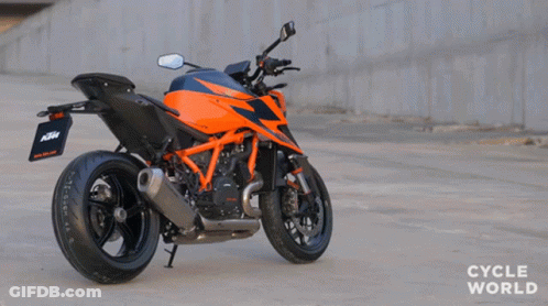 Orange And Black KTM Motorcycle Parked On Road GIF